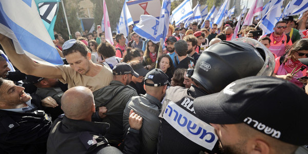 Police and protesters outside the Knesset in Jerusalem on March 27, 2023. Mostafa Alkharouf/Anadolu Agency via Getty Images.