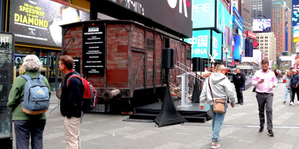 A replica of a Holocaust cattle car is on view in Times Square in honor of Yom Hashoah, April 18, 2023. (Julian Voloj)