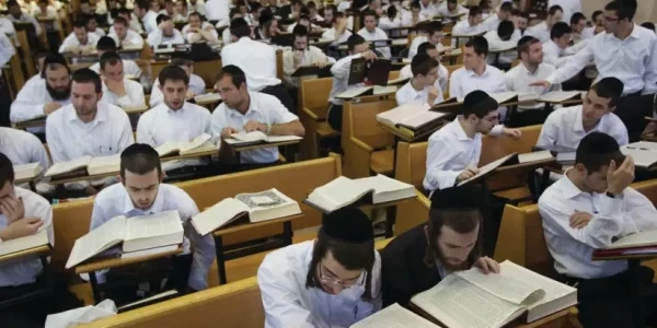 Jewish men study in a yeshiva. (credit: RONEN ZVULUN/REUTERS)